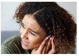 Beating Meniere's Disease - girl looking distressed while holding ear.