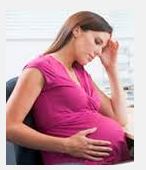 pregnancy and Meniere's disease - pregnant woman holding head